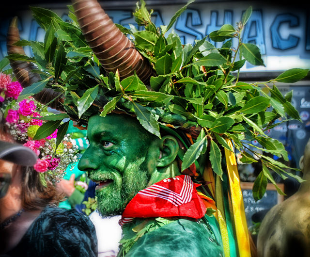A different man dressed as a plant at a Hastings festival