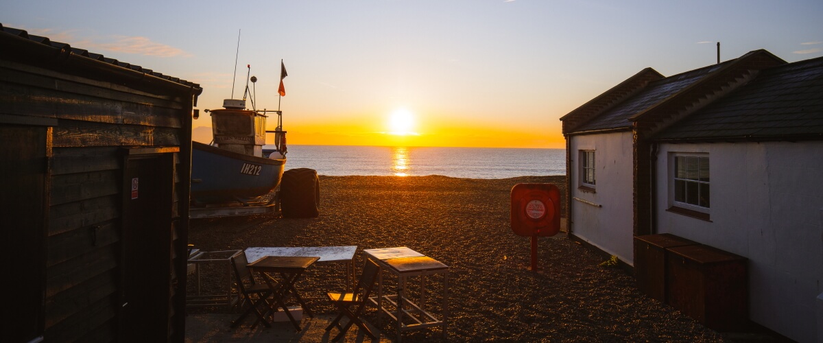 Beach huts at sunset