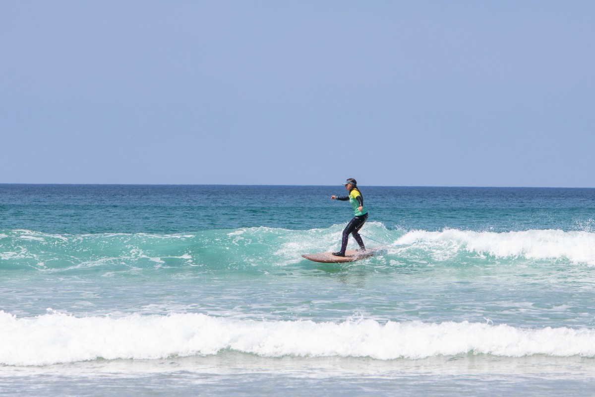 Surfer at Fistral Beach in Cornwall