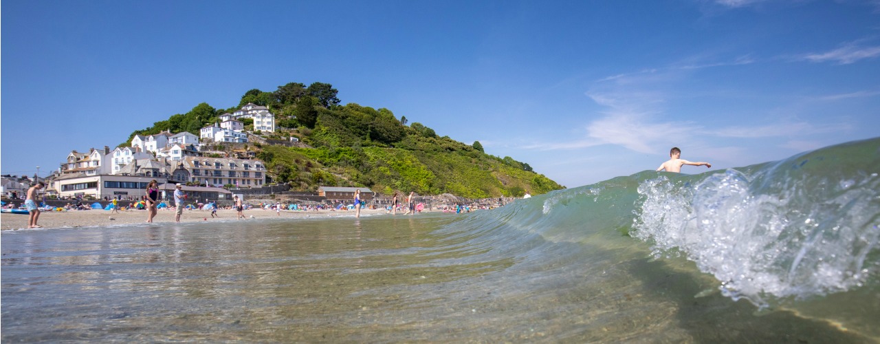 Surfing boy in Looe, South Cornwall