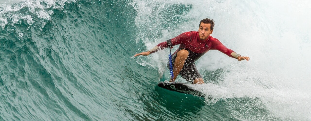 A surfer catching a wave