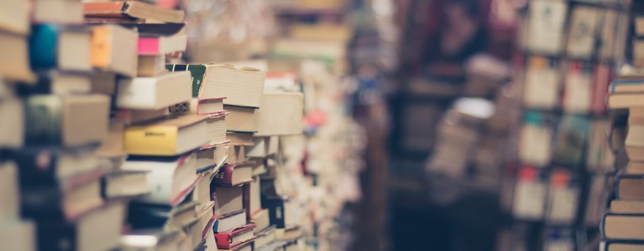 A bookshop with books stacked high