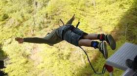 man bungee jumping in the Scottish highlands