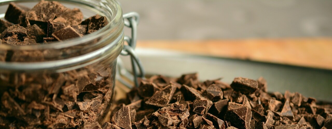 A jar full of chocolate pieces