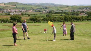 group of golfers on the highlands end pitch and putt course