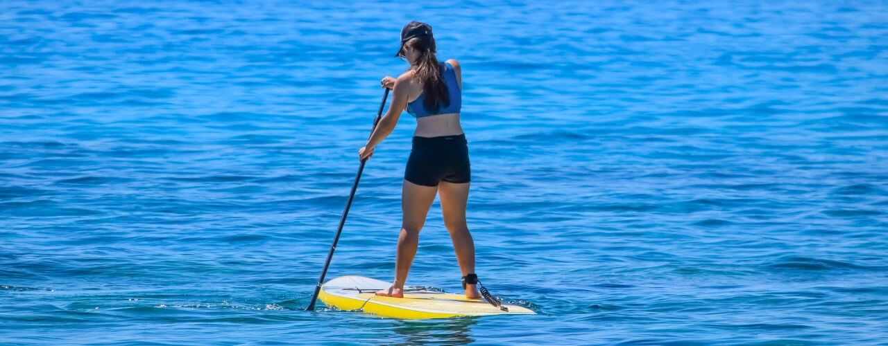 A paddleboarder on the Jurassic Coast