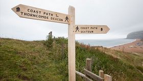signpost next to eype beach on the south west coastal path