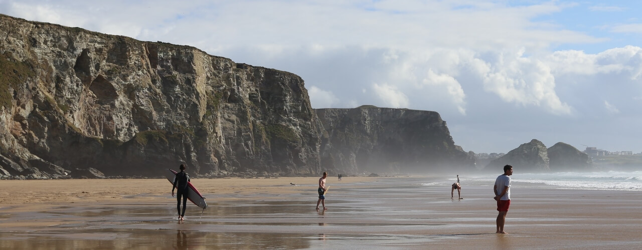 Surfers at Watergate Bay in Cornwall