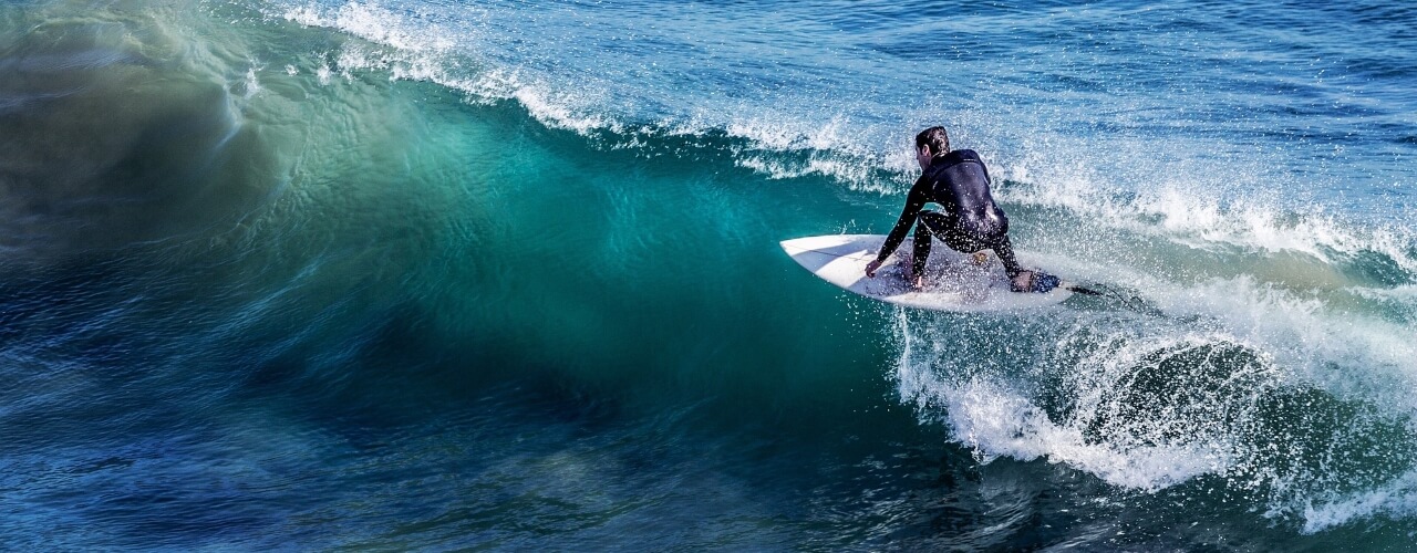 A surfer catching a wave