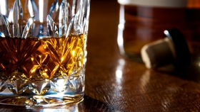 glass of whiskey on a bar
